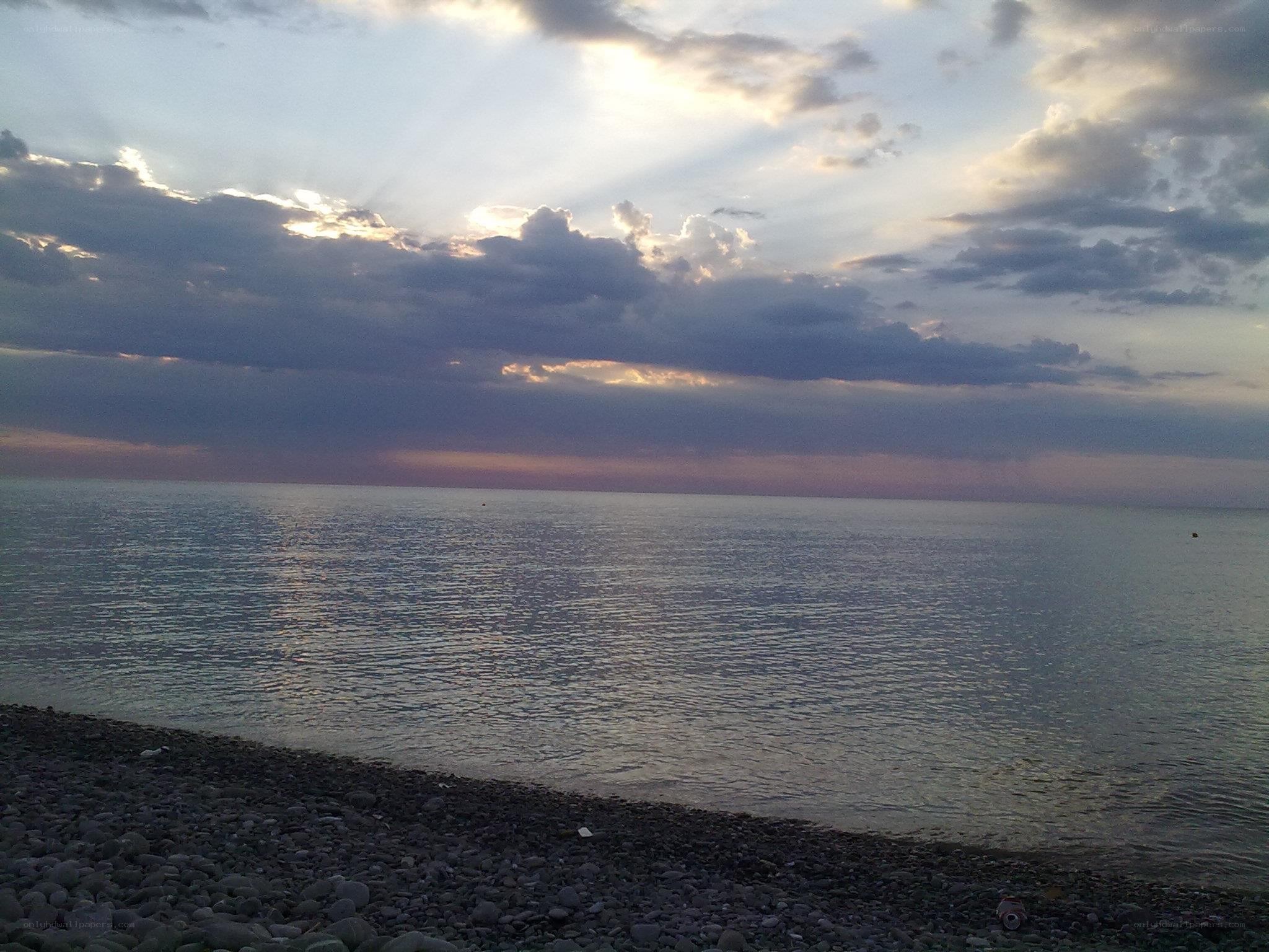 Sunset over the pebble beach