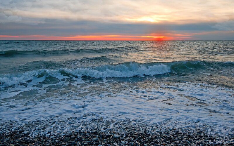Sunset over the pebble beach