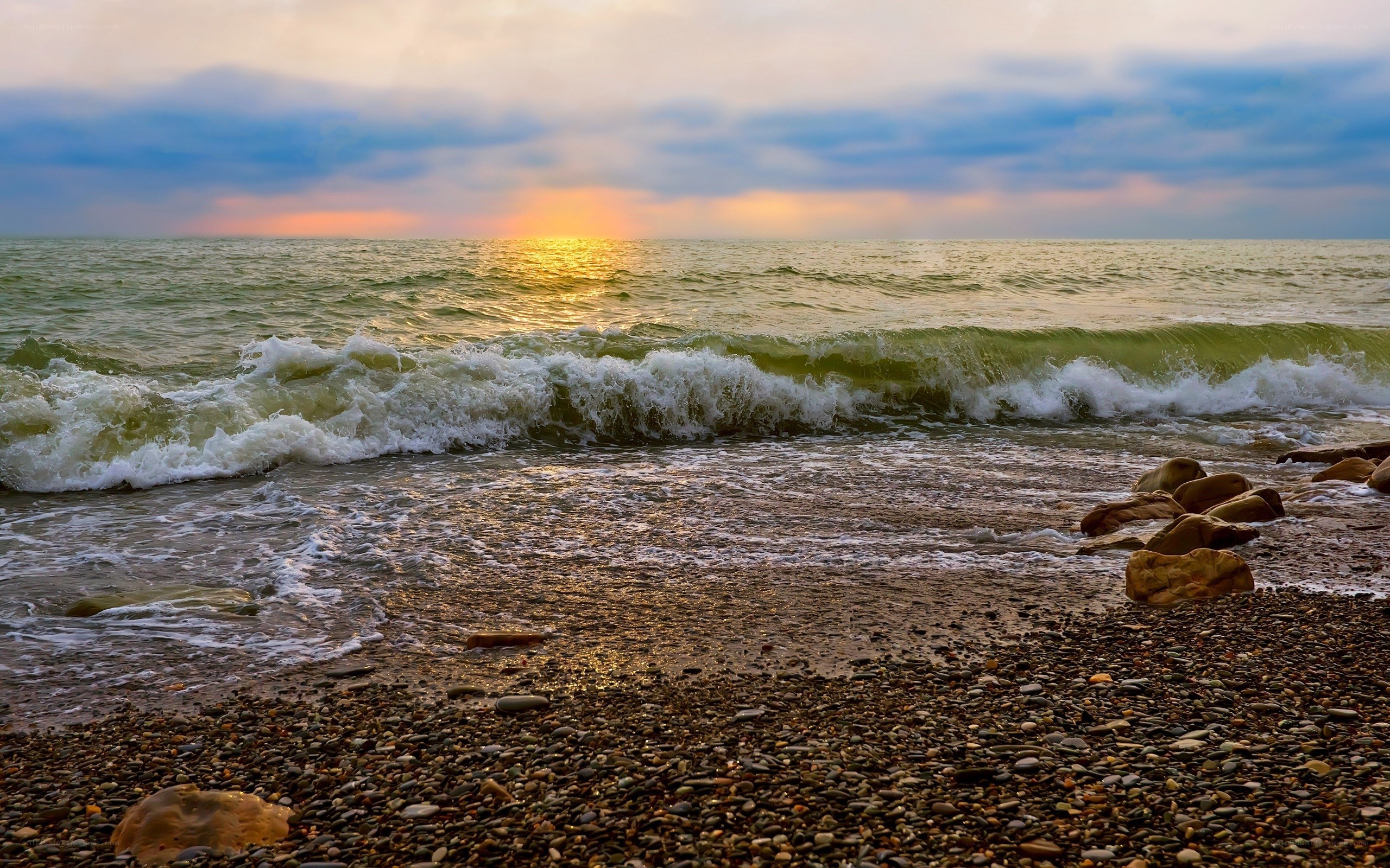 Sunset over the pebble beach
