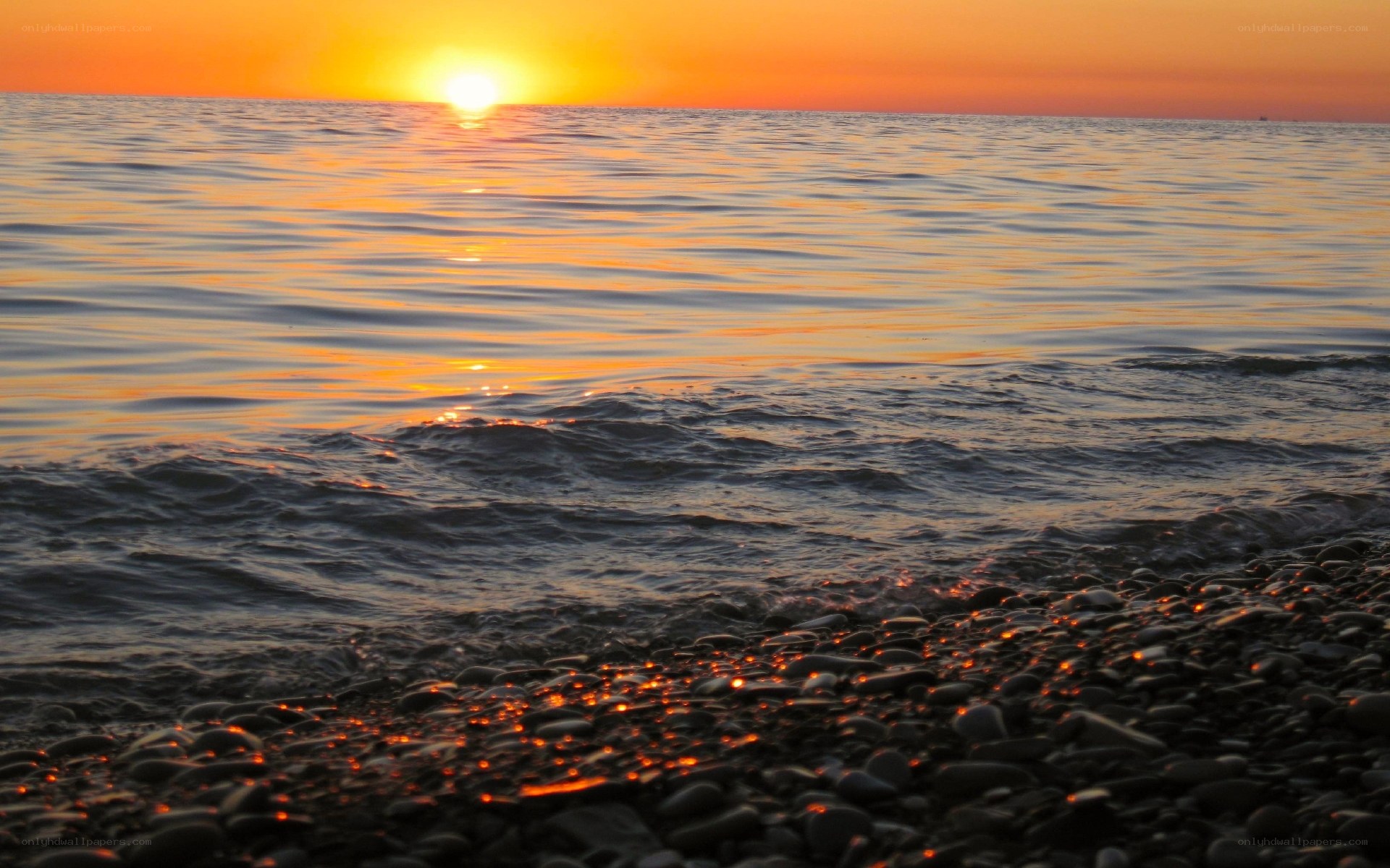 Sunset over the pebble beach