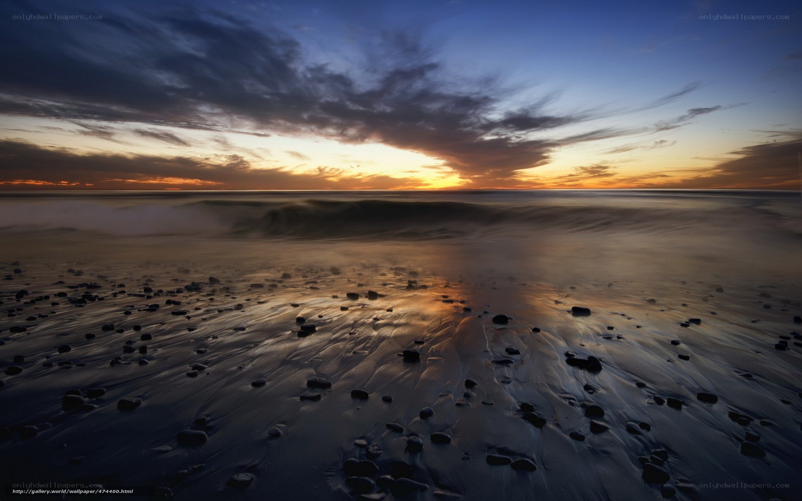 Sunset over the rocky beach