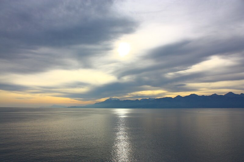 Sunset over the sea and mountains