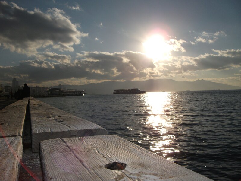Sunset over the sea with boats