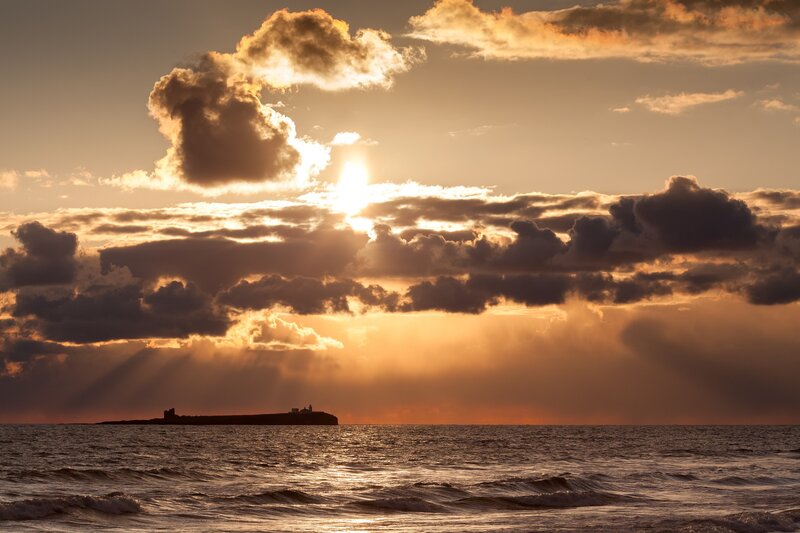 Sunset over the sea with clouds