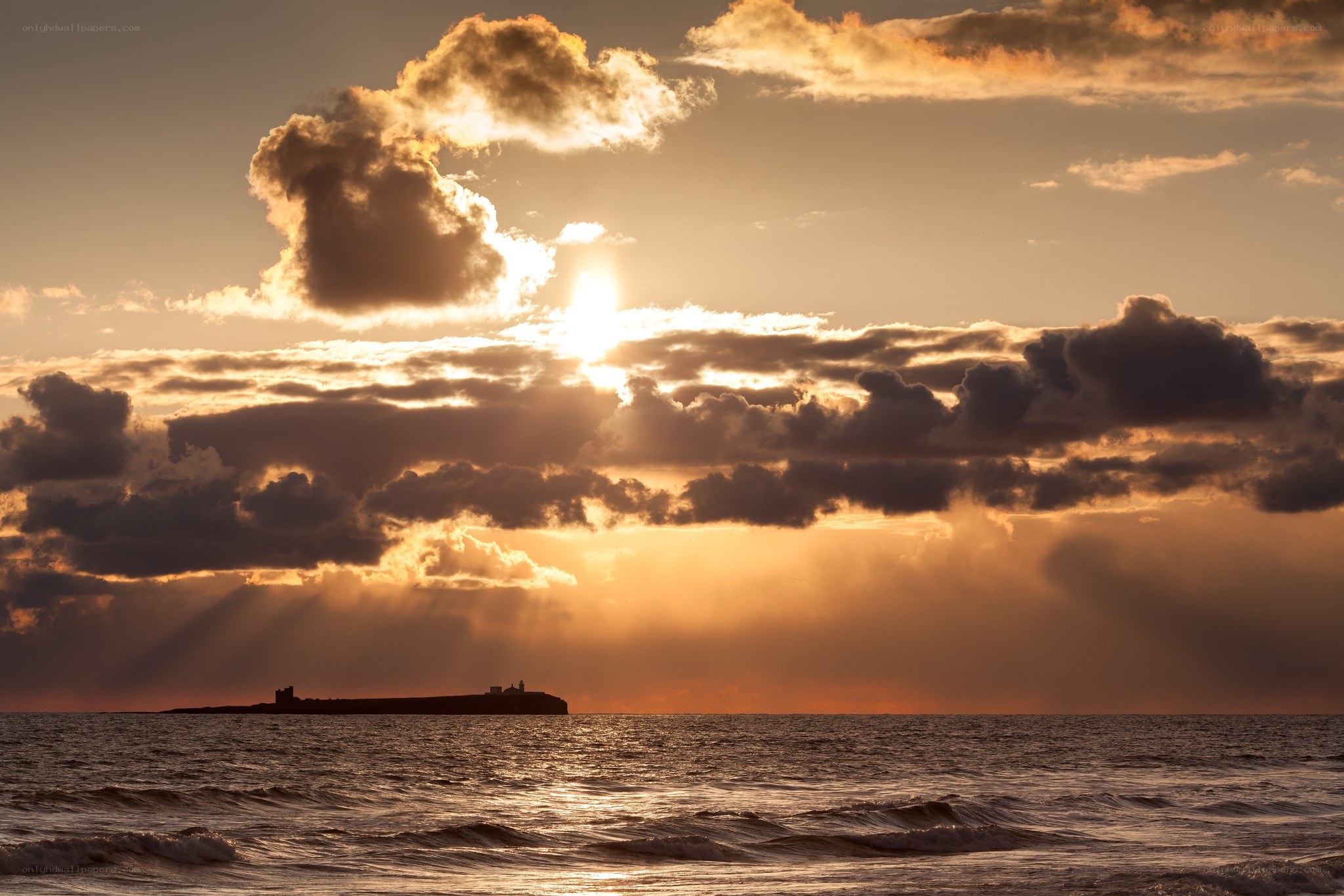 Sunset over the sea with clouds