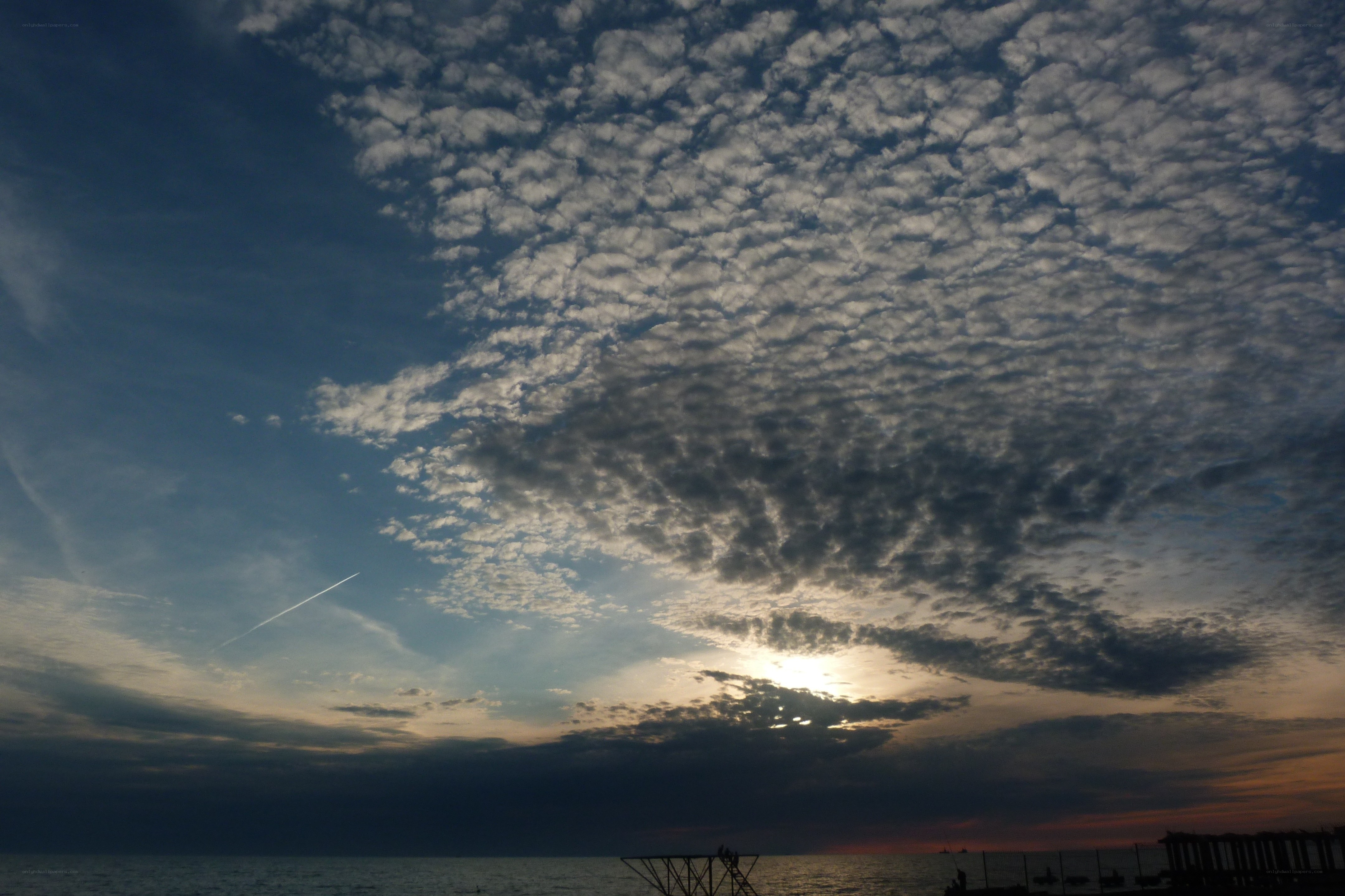 Sunset over the sea with clouds