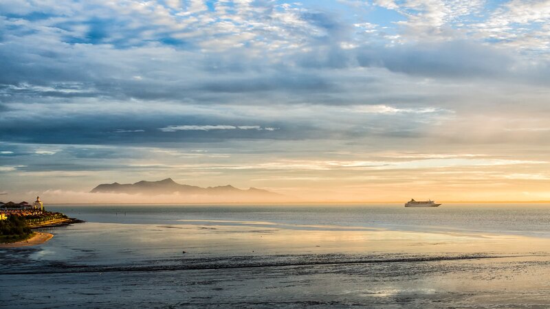Sunset over the sea with cruise ship