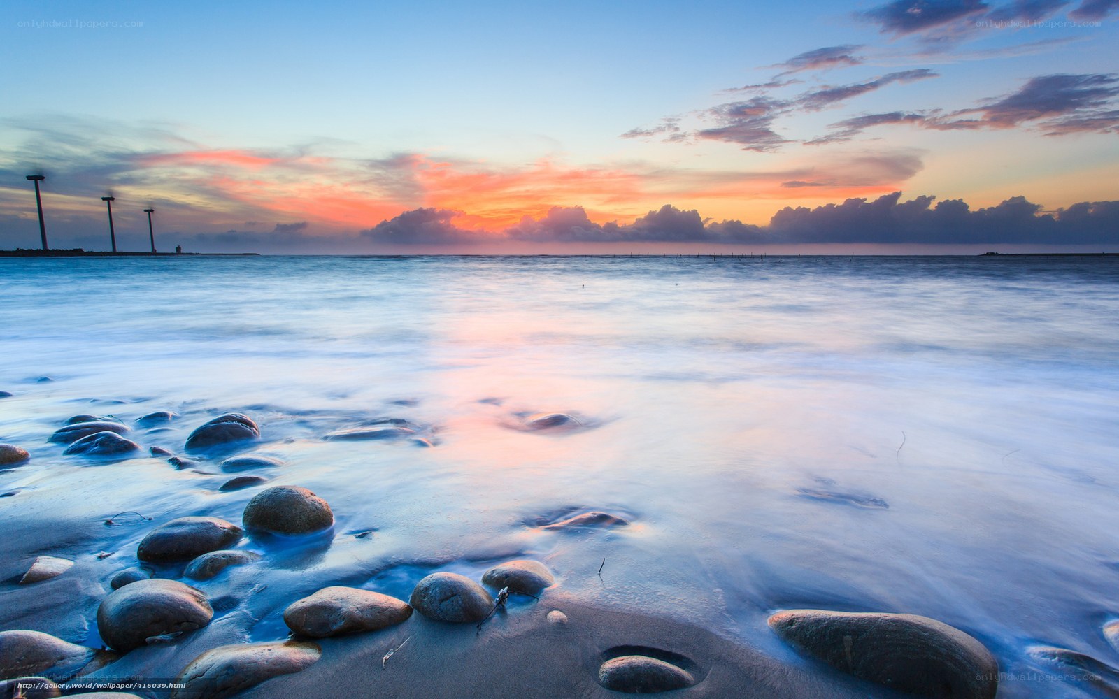 Sunset over the sea with rocks