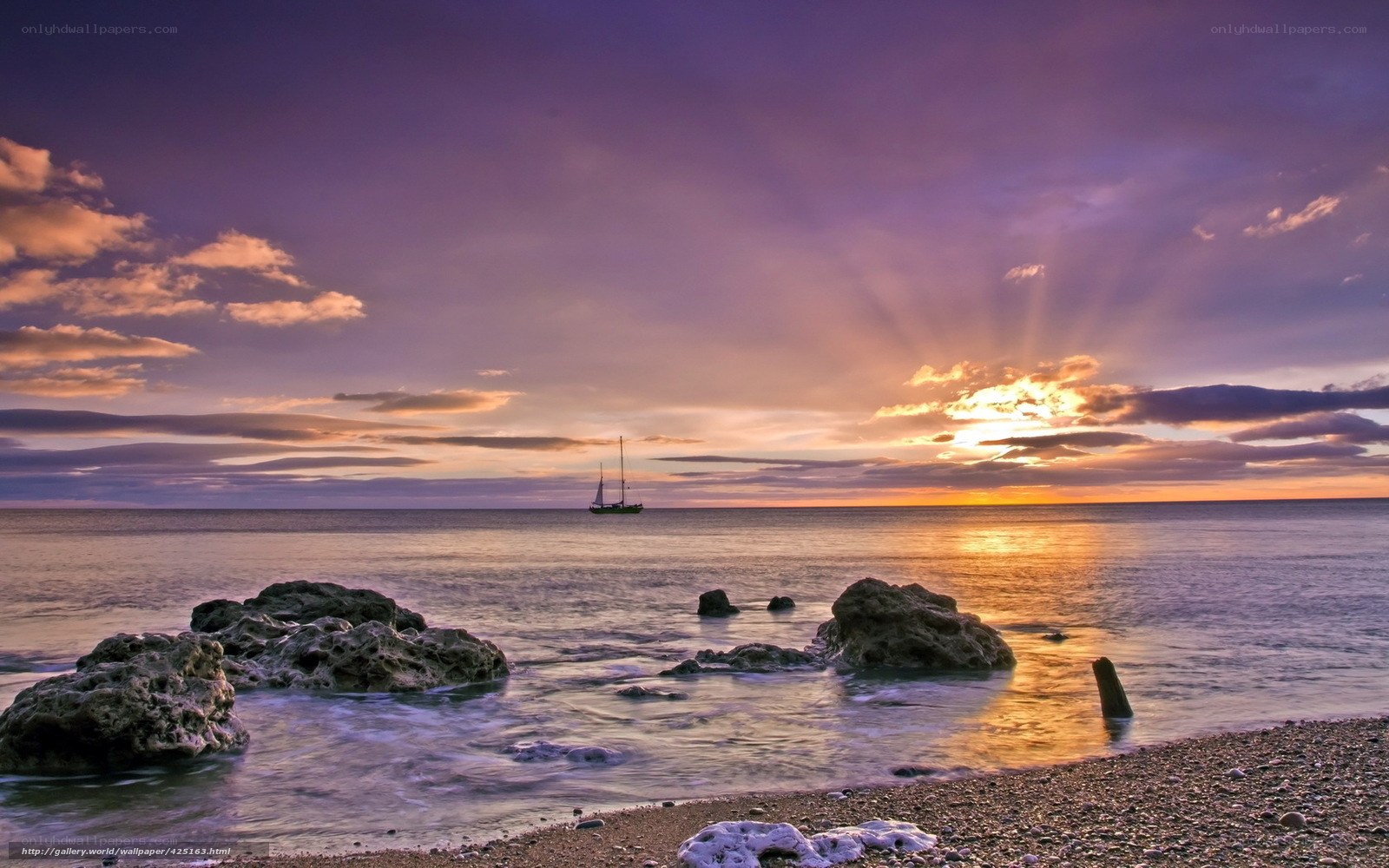 sunset over the sea with sailboat