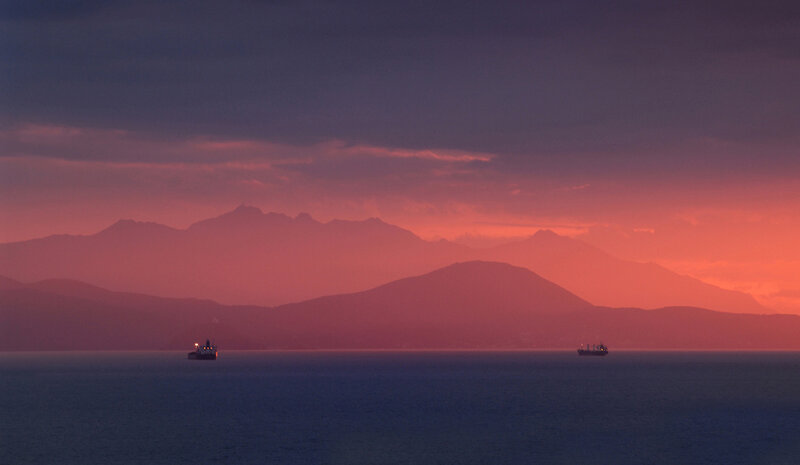 Sunset over the sea with ships