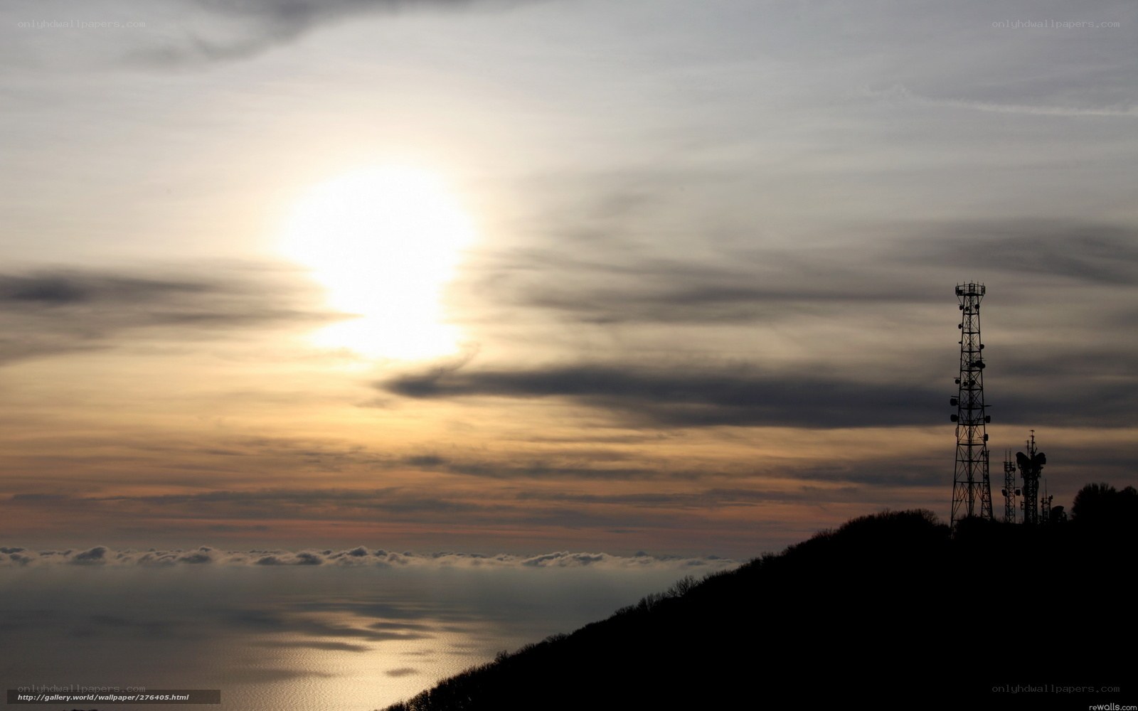 Sunset over the sea with towers