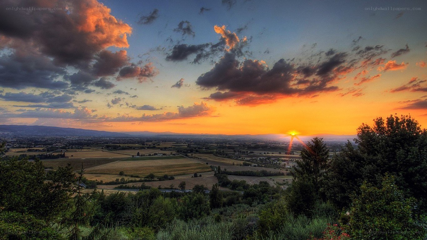 sunset over the tuscan hills