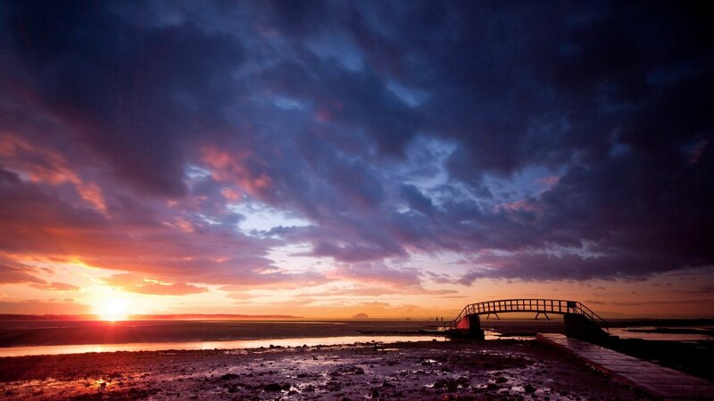 Sunset over Tidal Flats — Purple, Dramatic, Photograph, Bridge, Clouds, Sun
