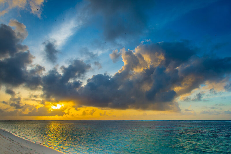 Sunset over Tropical Beach — Blue, Dramatic, Photograph, Clouds, Ocean