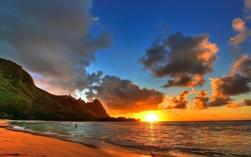 Sunset over Tropical Beach — Blue, Dramatic, Photograph, Mountain, Ocean, Person