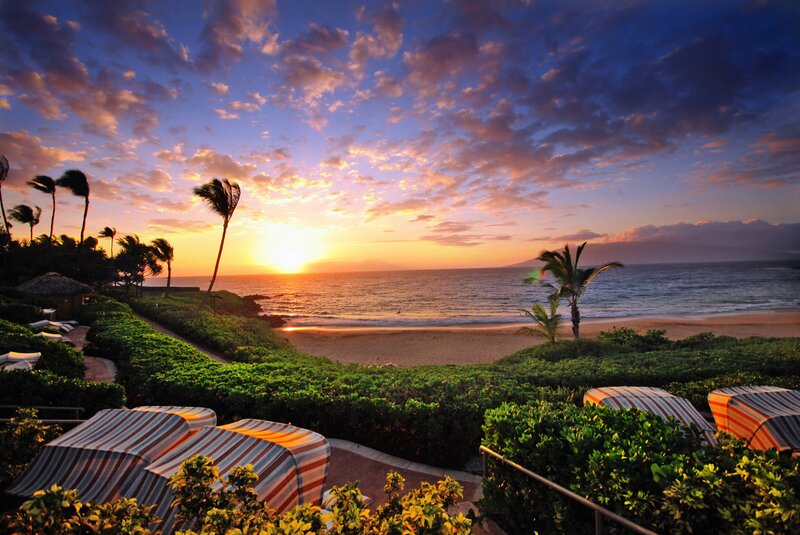 Sunset over Tropical Beach — Orange, Serene, Photograph, Palm Trees, Striped Umbrellas