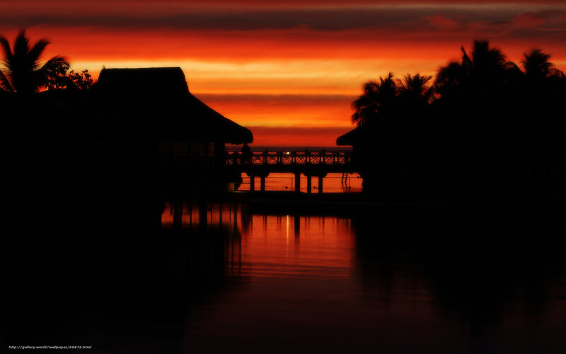 Sunset over tropical bungalows