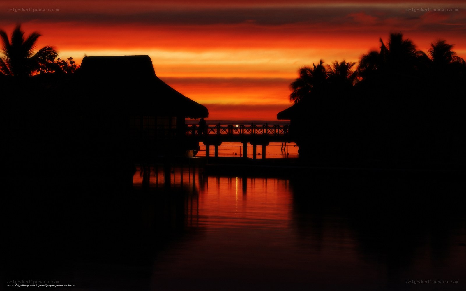 Sunset over tropical bungalows