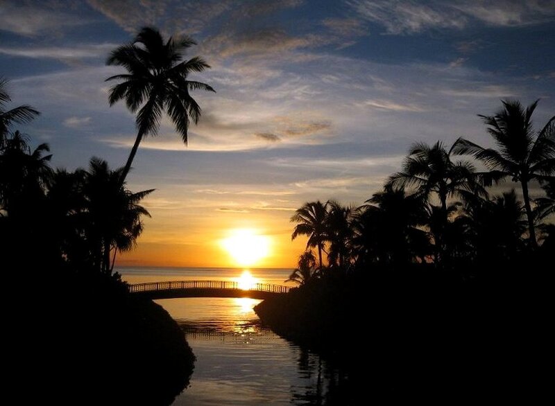 sunset over tropical canal