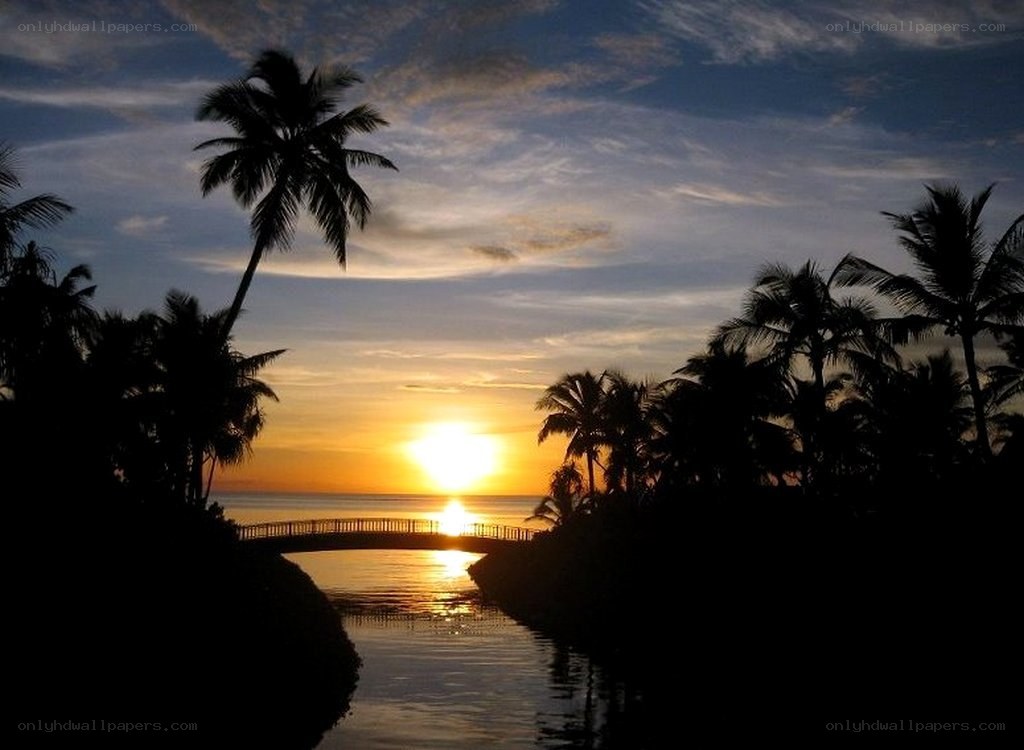 sunset over tropical canal