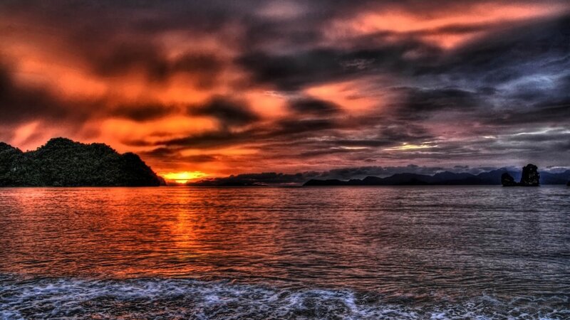 Sunset over Tropical Sea — Orange, Dramatic, Photograph, Island, Clouds, Mountains, Waves, Red