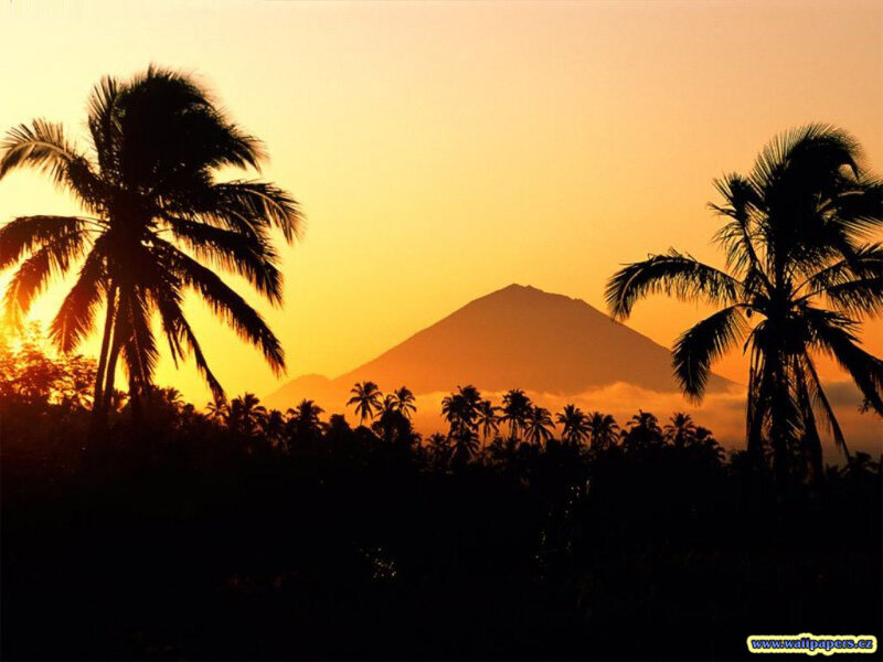 sunset over tropical volcano