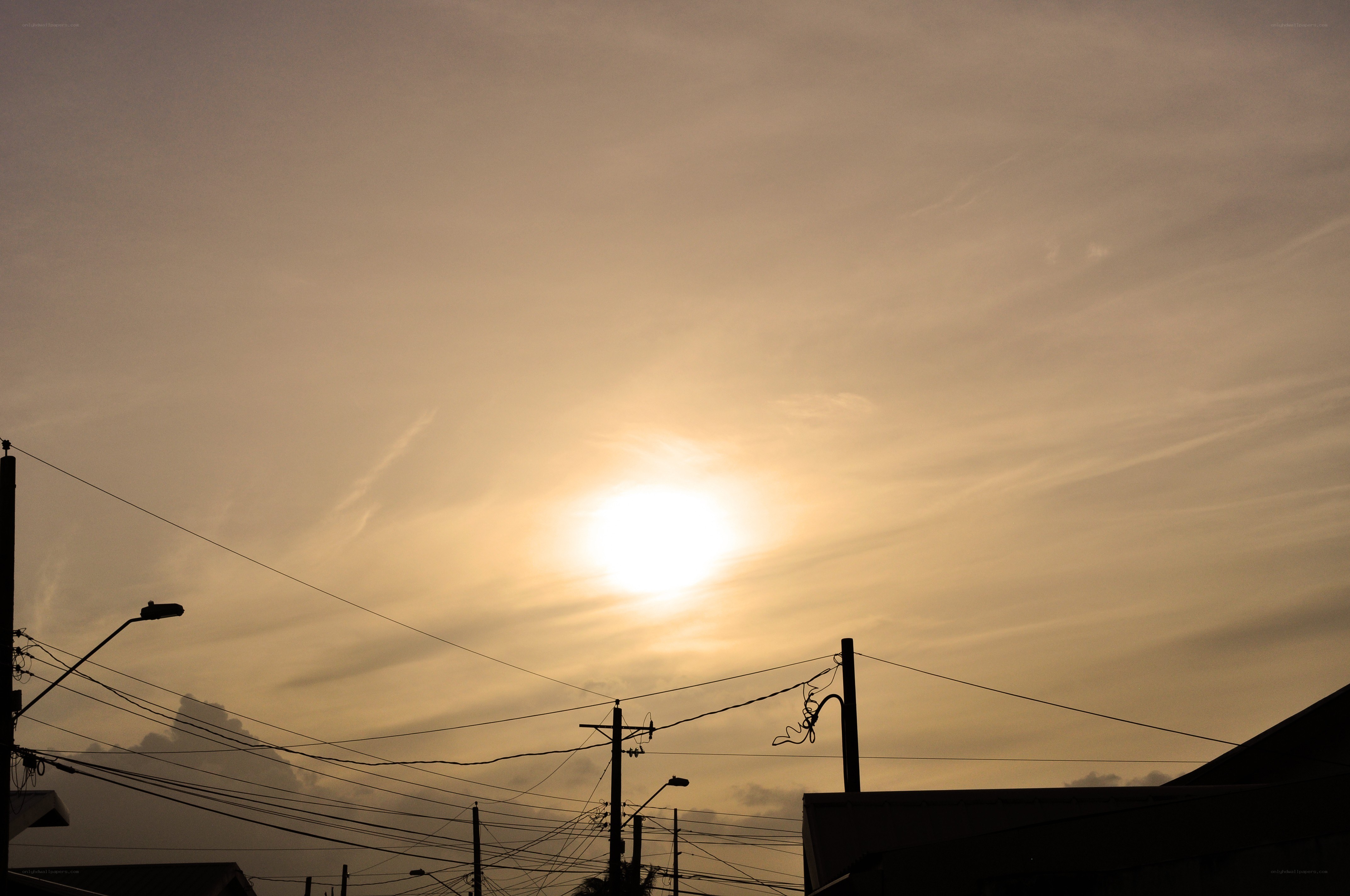 Sunset over utility poles