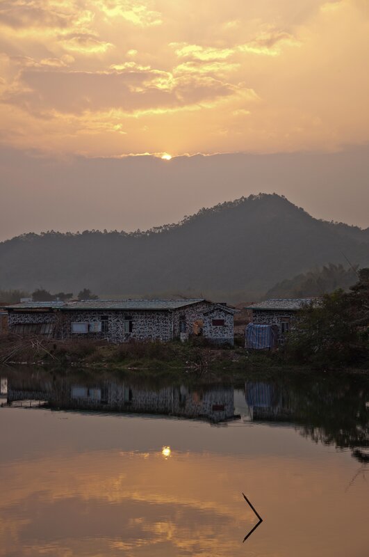 Sunset over village houses