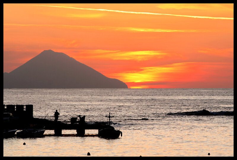 Sunset over volcanic island
