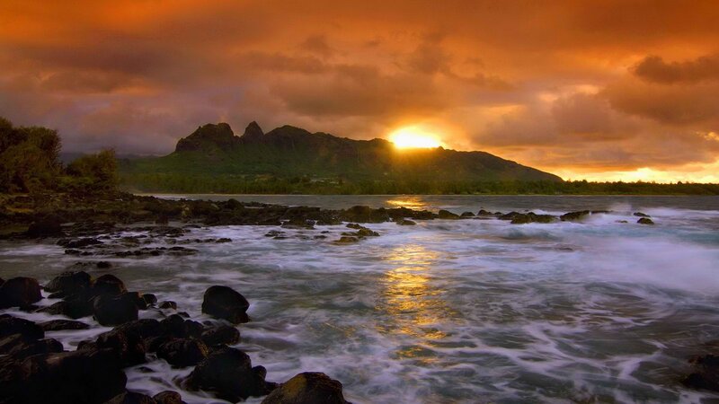Sunset over volcanic island