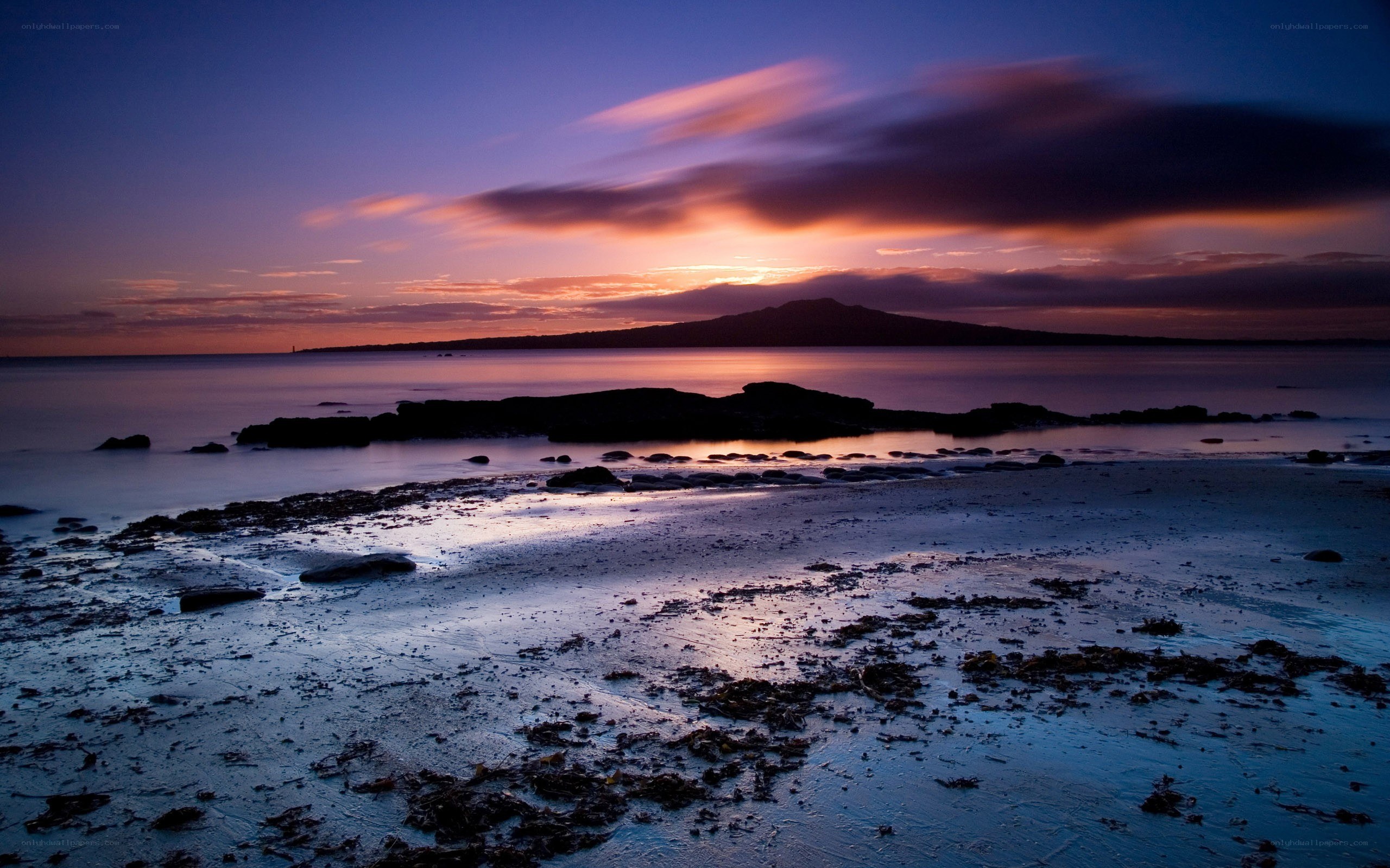 Sunset over volcanic island