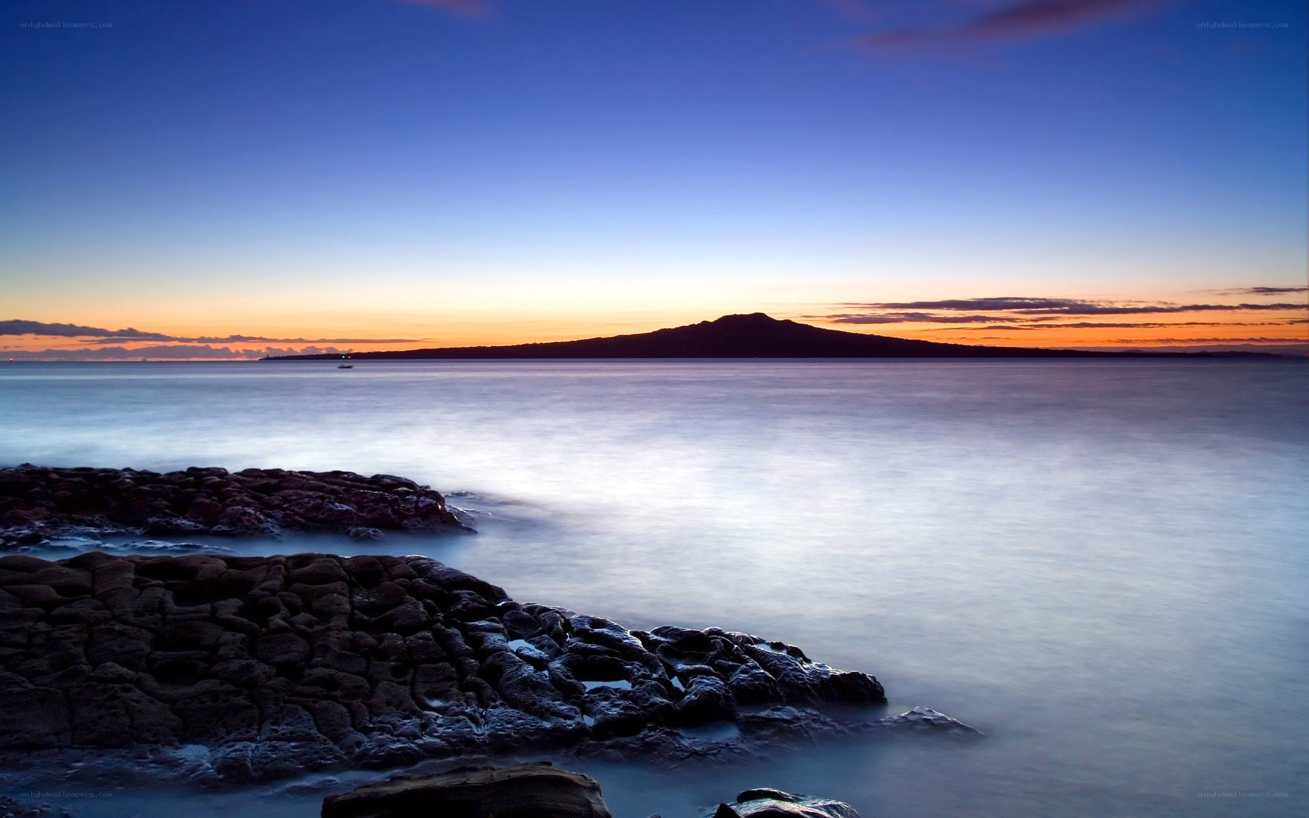 Sunset over volcanic island