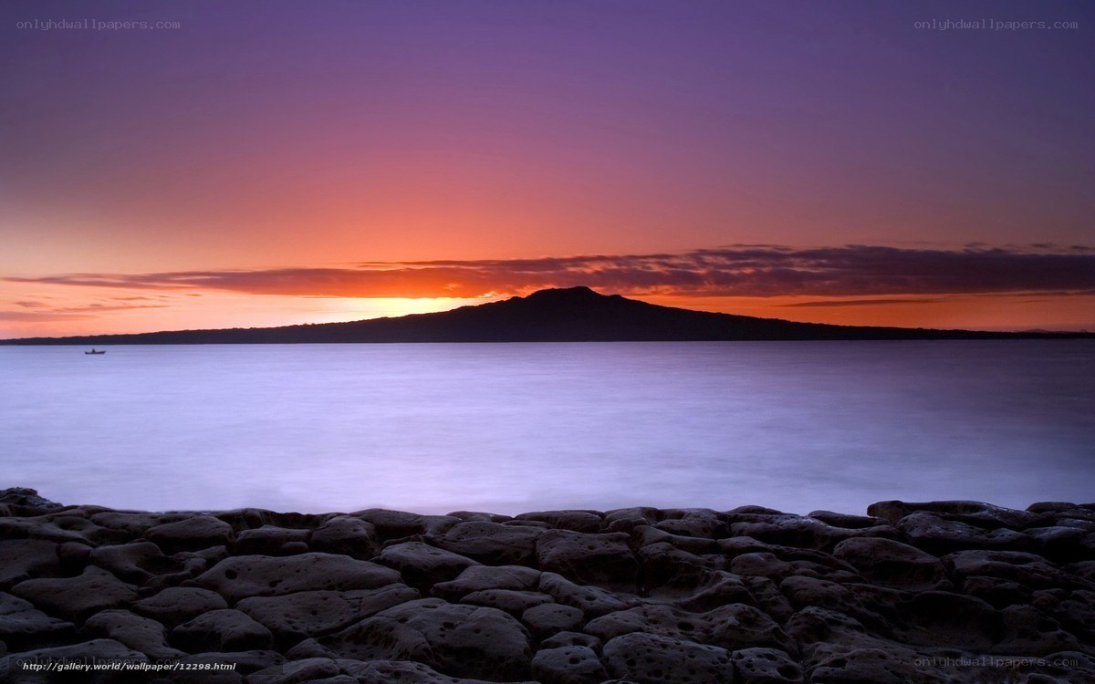 Sunset over volcanic island