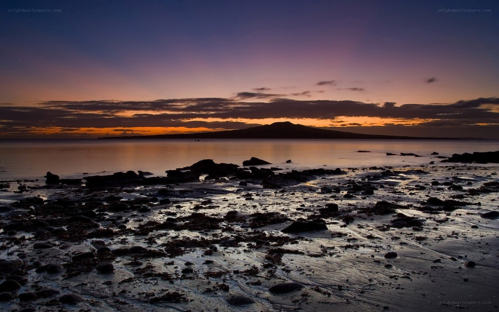 Sunset over volcanic island