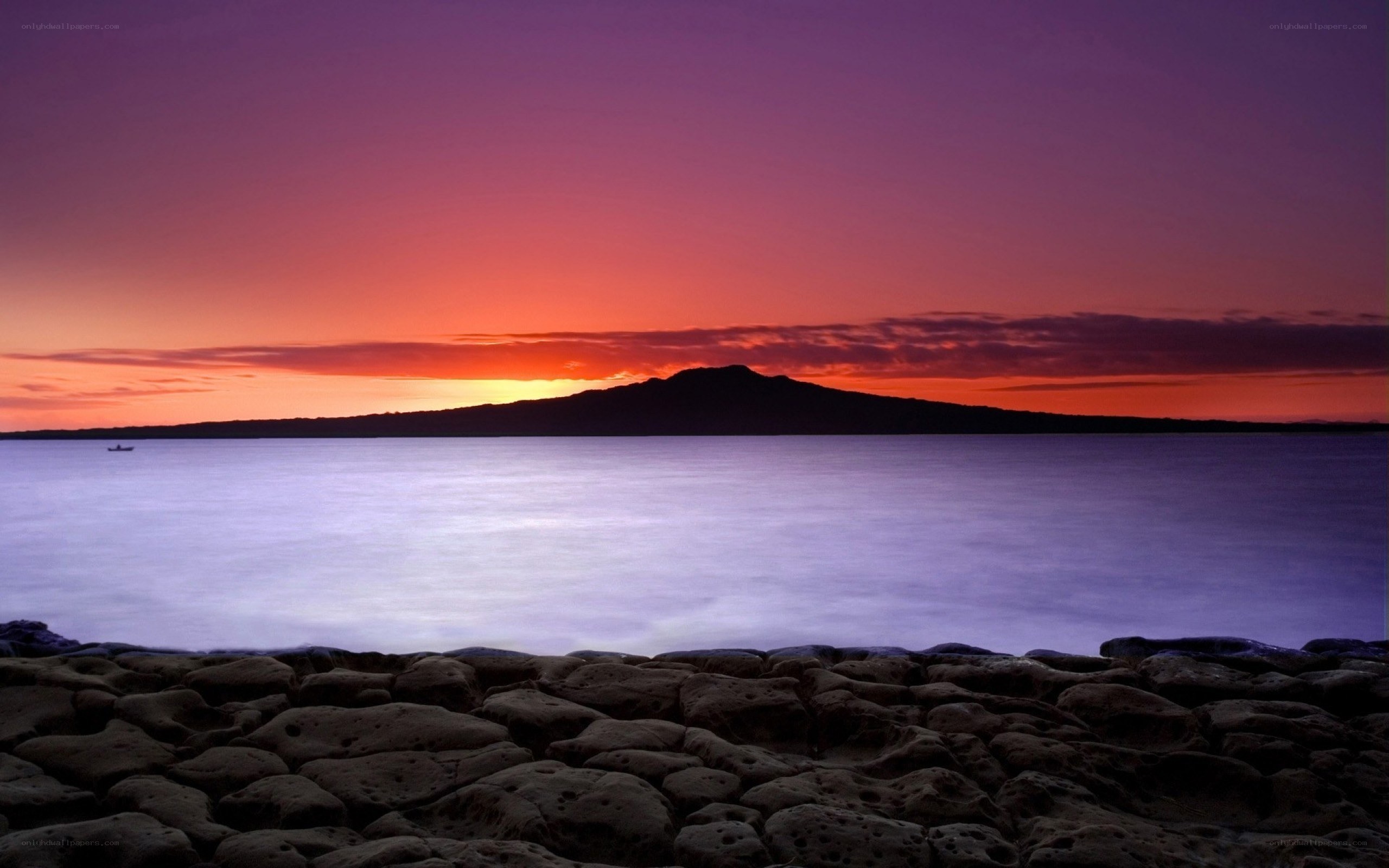 Sunset over volcanic island