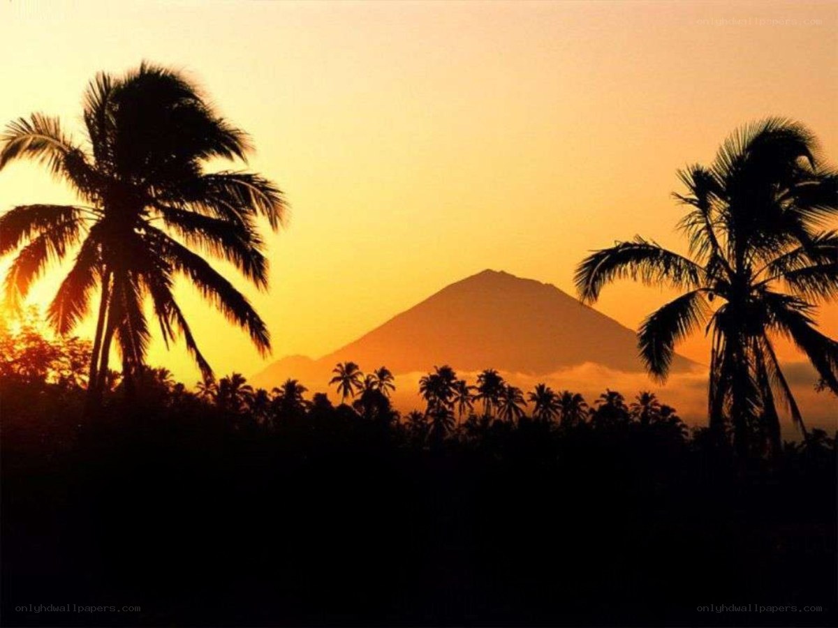 sunset over volcanic island