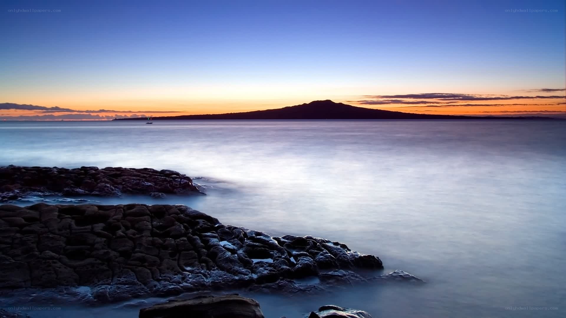 Sunset over volcanic island