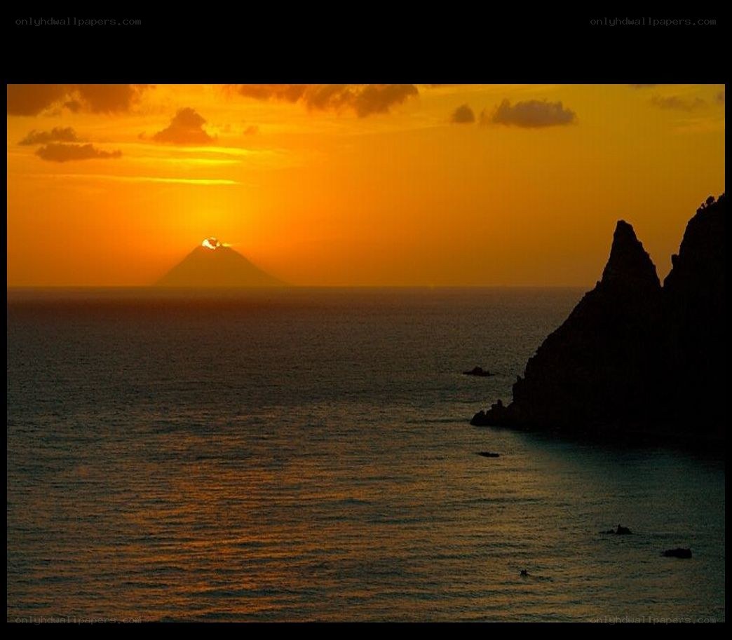 Sunset over volcanic island
