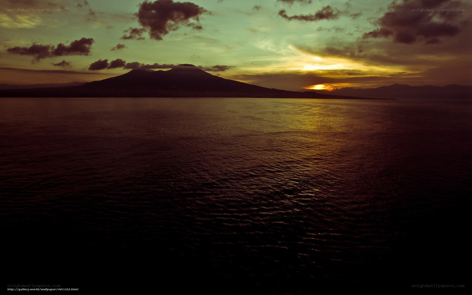 Sunset over volcanic island