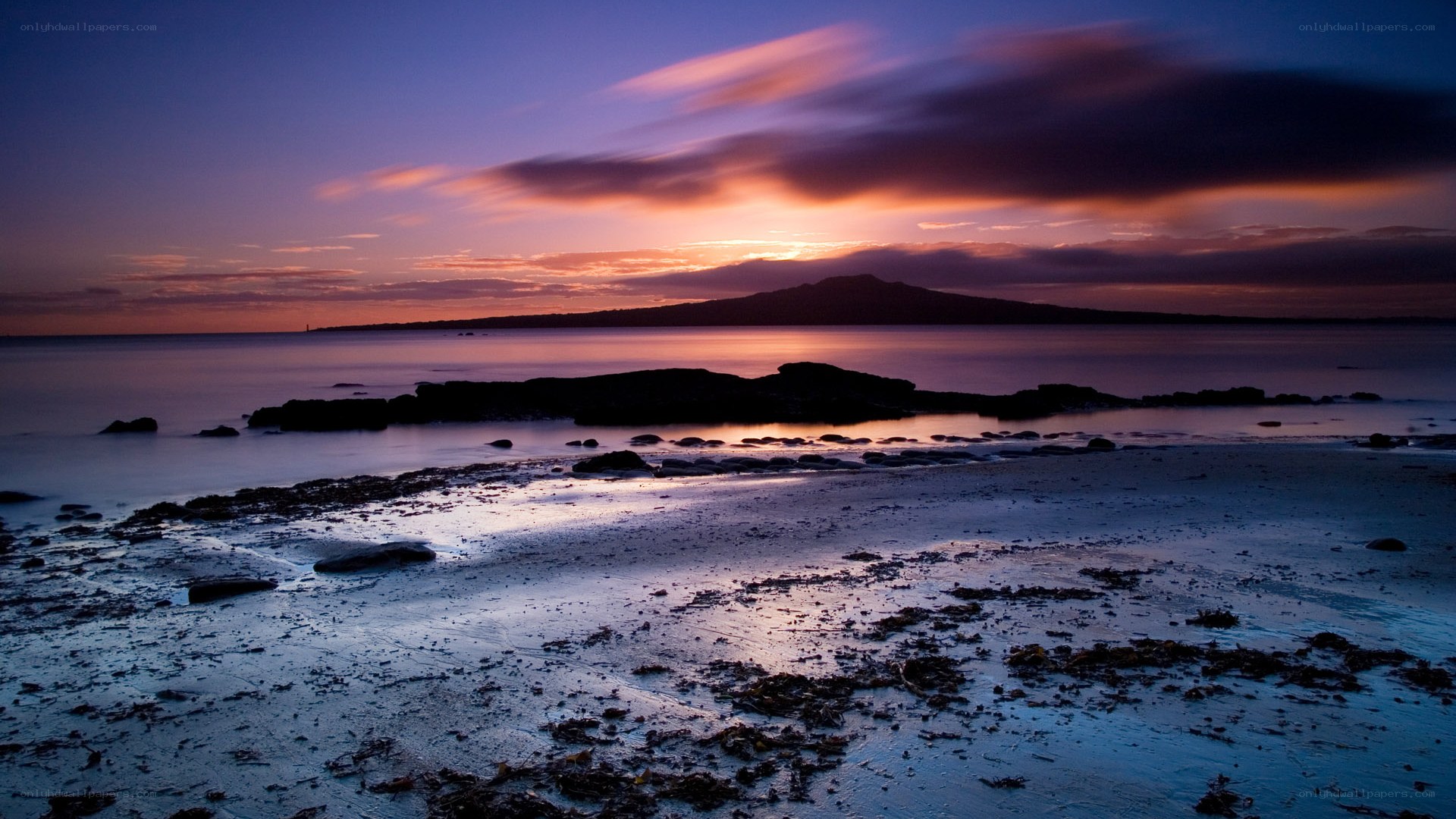 Sunset over volcanic island