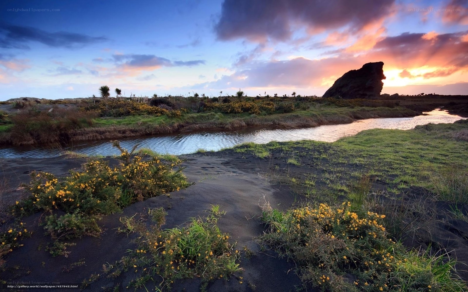 sunset over volcanic landscape
