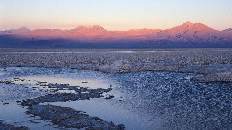 sunset over volcanic mountains