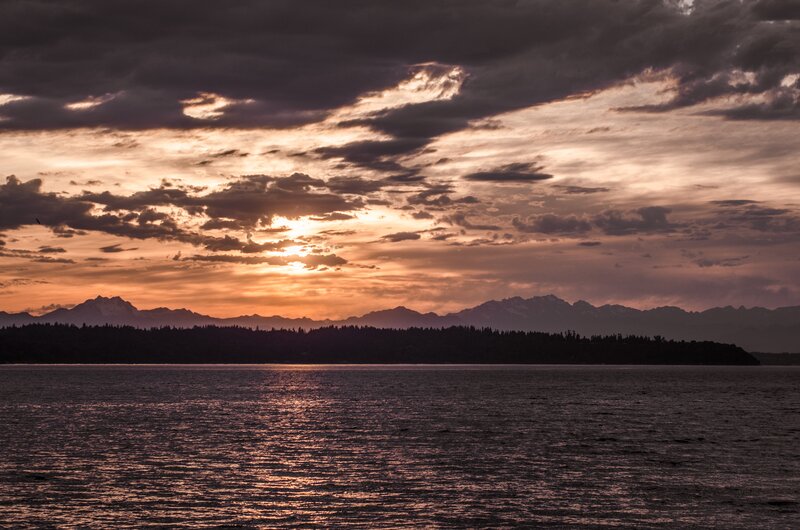 Sunset over Water and Mountains — Orange, Dramatic