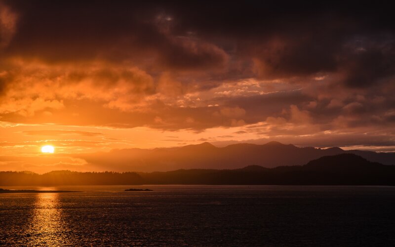 Sunset over Water and Mountains — Orange