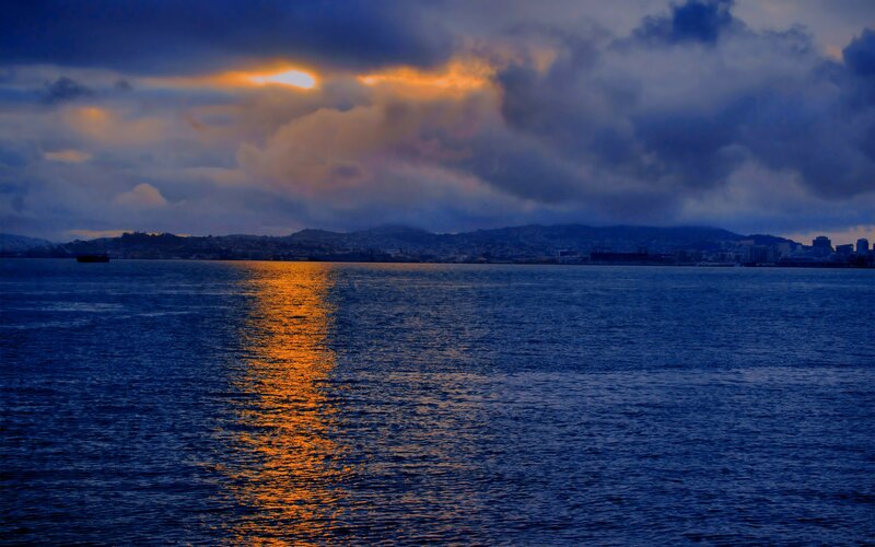 Sunset over Water — Blue, Dramatic, Photograph, Clouds, Cityscape