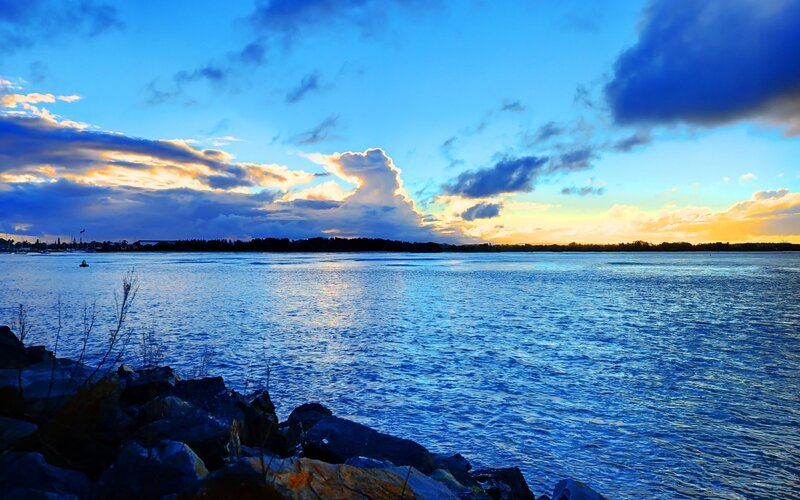 Sunset over Water — Blue, Dramatic, Photograph, Clouds, Rocks