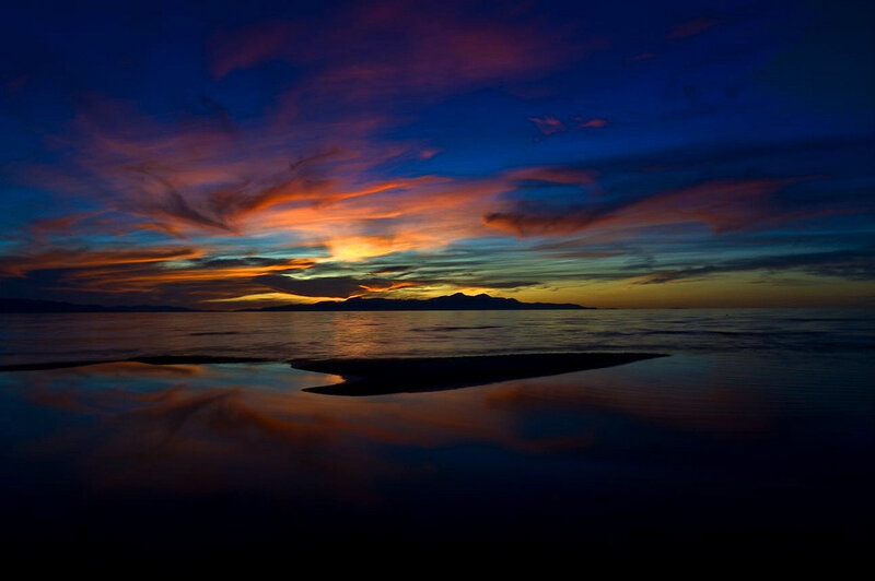 Sunset over Water — Blue, Dramatic, Photograph, Mountains, Clouds