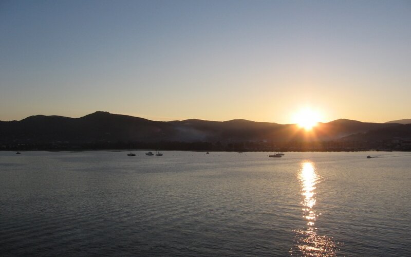 Sunset over Water — Blue, Serene, Photograph, Mountains, Boats