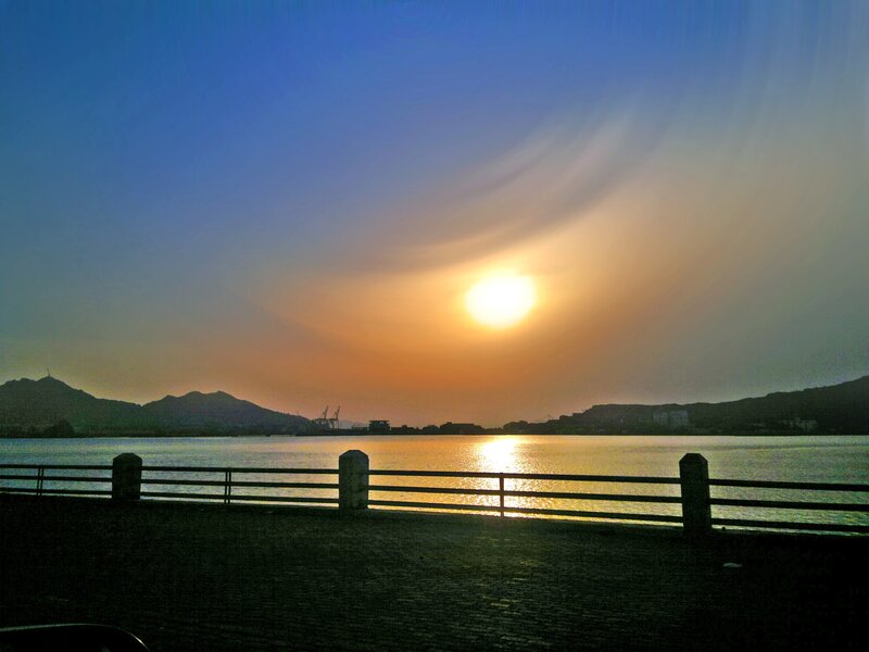 Sunset over Water — Blue, Serene, Photograph, Mountains, Railing