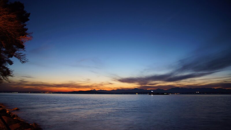 Sunset over Water — Blue, Serene, Photograph, Mountains, Tree